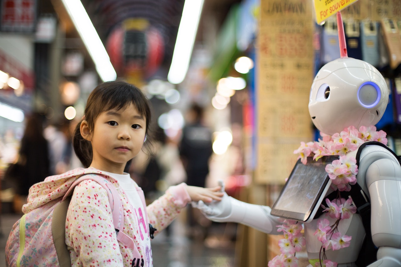 Image of young girl and robot